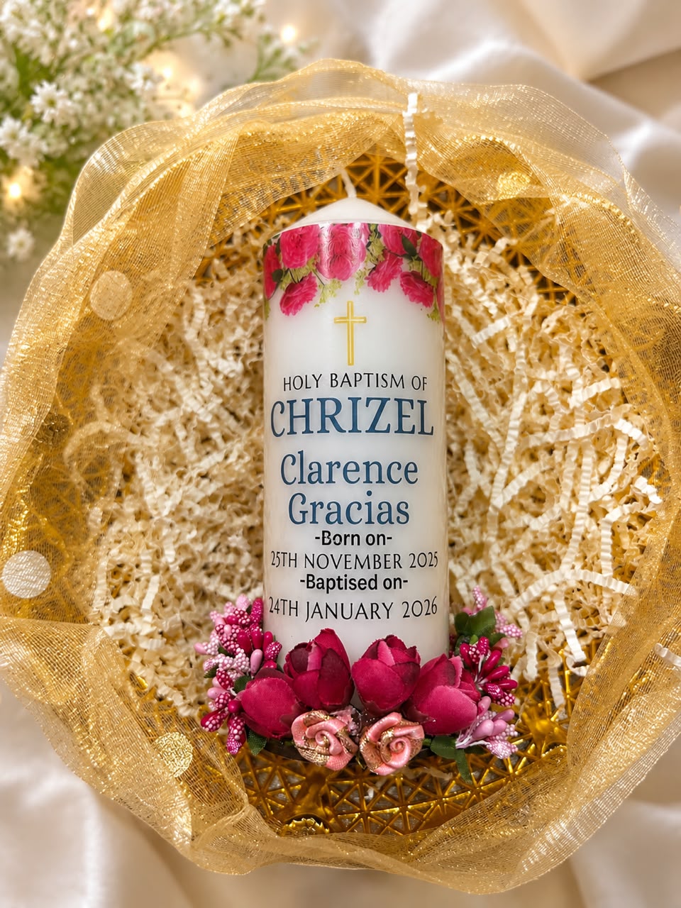 Personalised baptism candle for Chrizel with pink roses, in a gold gift basket